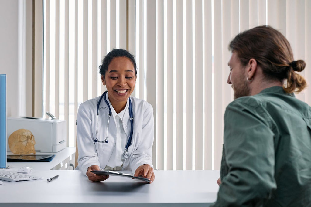 A photo of a patient listening to a doctor