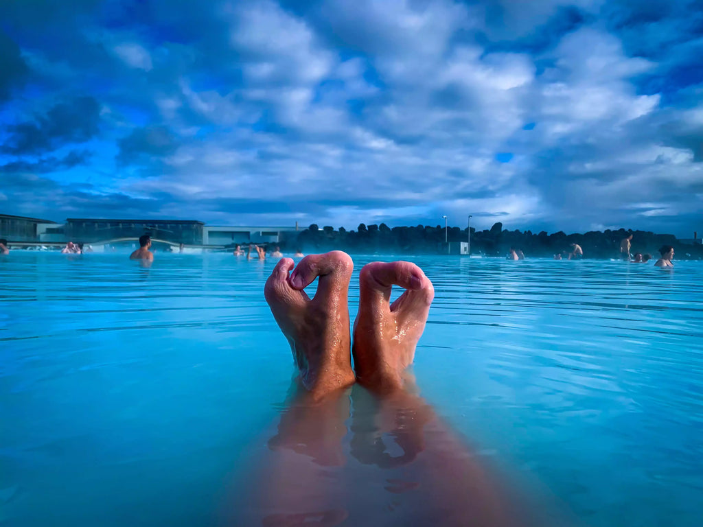 Disabled feet submerged in a pool, symbolizing resilience and self-acceptance. A personal reflection on living with a visible disability and societal perception.