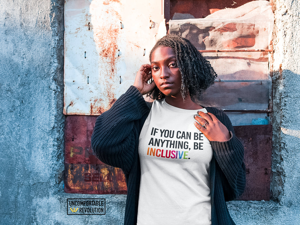 Model wearing an inclusive URevolution T-shirt that reads, ‘If you can be anything, be inclusive.’