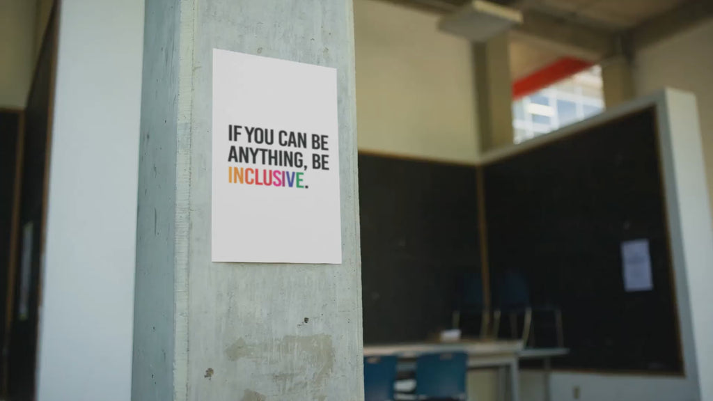 A woman pauses to reflect while looking at a DEI poster about inclusion and diversity, displayed on a modern wall. Ideal for offices, schools, and workplaces.