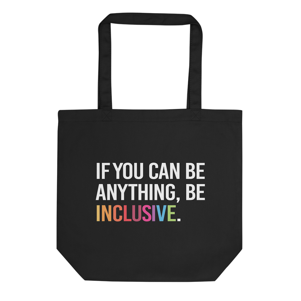 Picture of URevolution's eco-friendly organic Be Inclusive tote bag featuring our original phrase printed in white upper case letters: "If you can be anything, Be Inclusive." The word inclusive is in the colors of the rainbow. The phrase takes up three-quarters of the tote bag.  